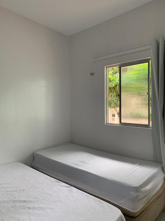 Postel nebo postele na pokoji v ubytování Happy Hostel e Pousada Paracuru