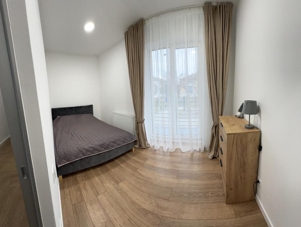 Postel nebo postele na pokoji v ubytování Modern apartament