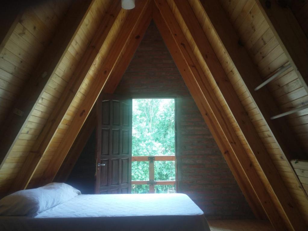 Postel nebo postele na pokoji v ubytování Cabana Alpina en La Granja