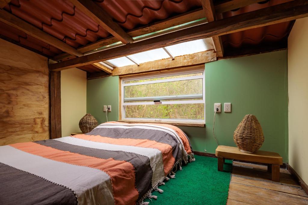 Tempat tidur dalam kamar di Yoo'Nashi - Estancia Ecológica y Experiencias Comunitarias