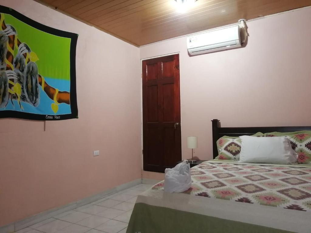 Postel nebo postele na pokoji v ubytování Casa Quepos