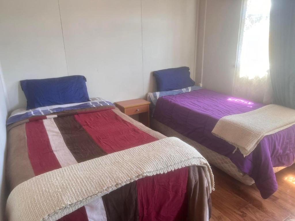 Postel nebo postele na pokoji v ubytování Hostal Sandrita