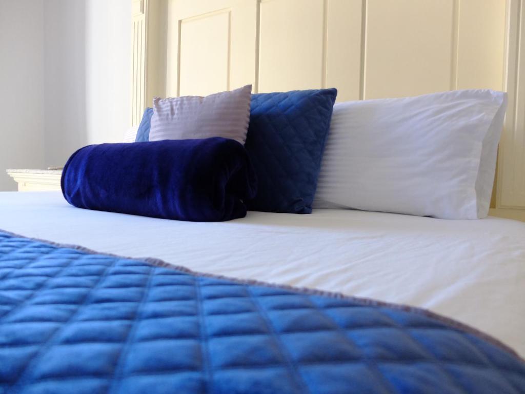 Postel nebo postele na pokoji v ubytování Hotel Estancia Real