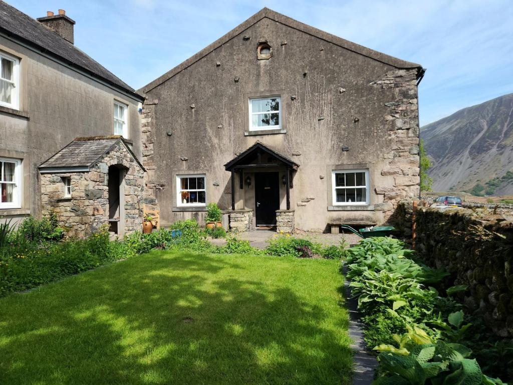 an old stone house with a grass yard at 2 Bed in Wasdale SZ515 in Nether Wasdale