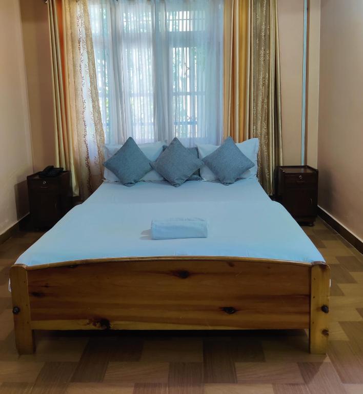 Postel nebo postele na pokoji v ubytování The Shire Kalimpong