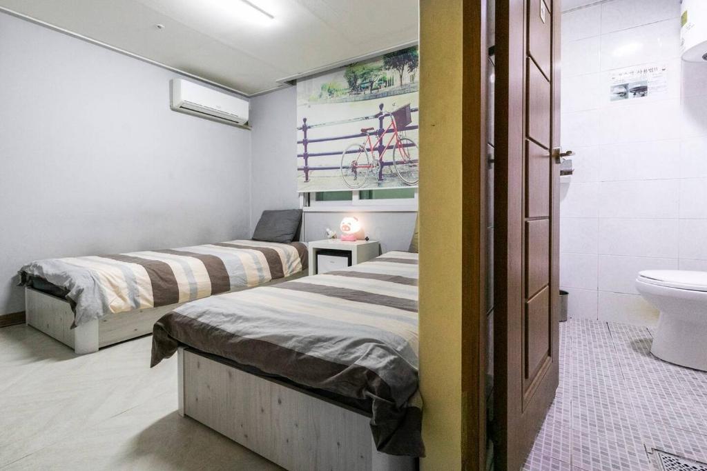 Postel nebo postele na pokoji v ubytování 24Guesthouse Seomyeon