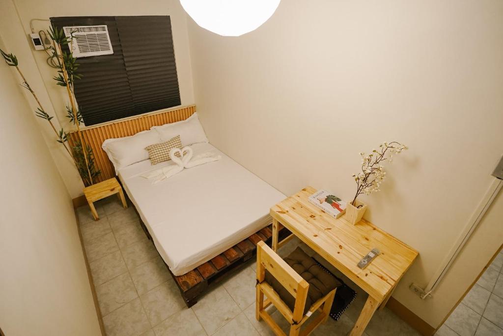 Postel nebo postele na pokoji v ubytování Pallet Homes - Megaworld