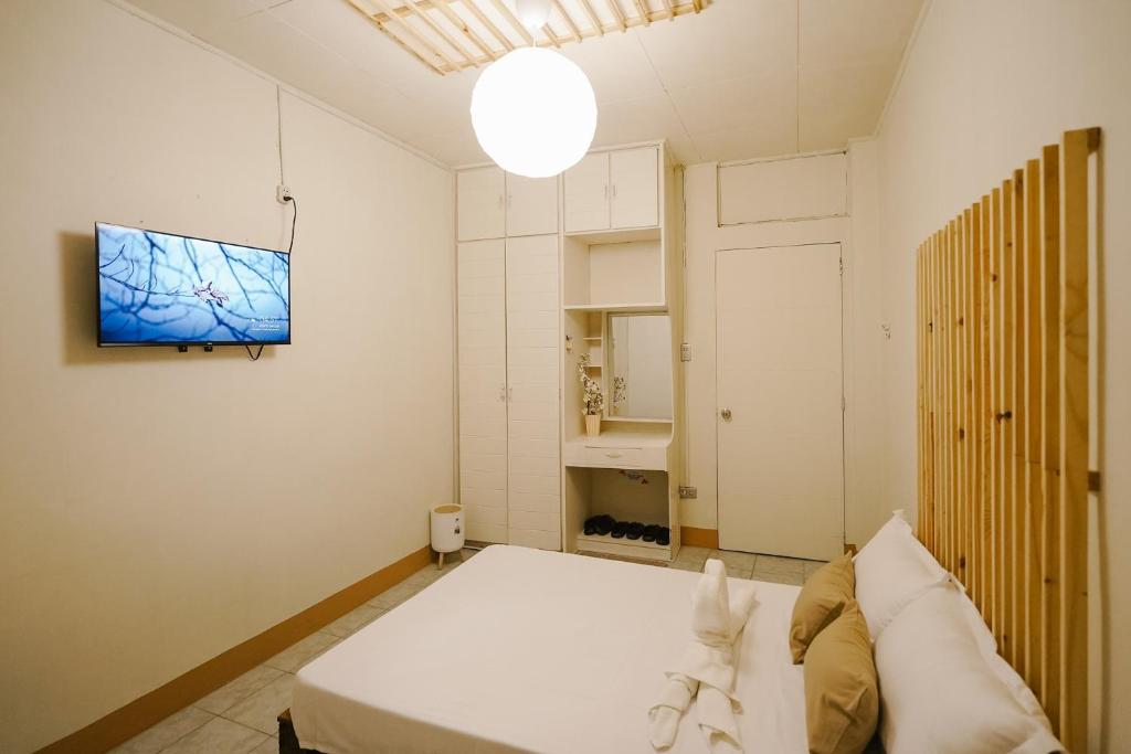 Postel nebo postele na pokoji v ubytování Pallet Homes - Megaworld