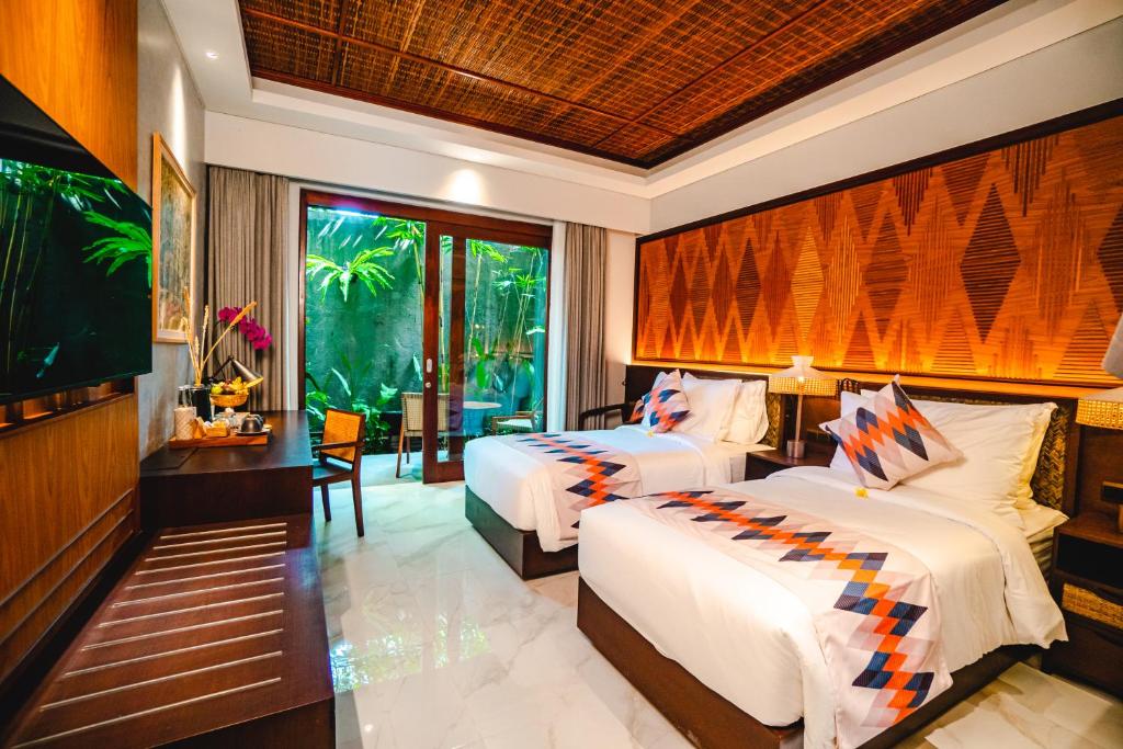 Postel nebo postele na pokoji v ubytování The Hava Ubud A Pramana Experience