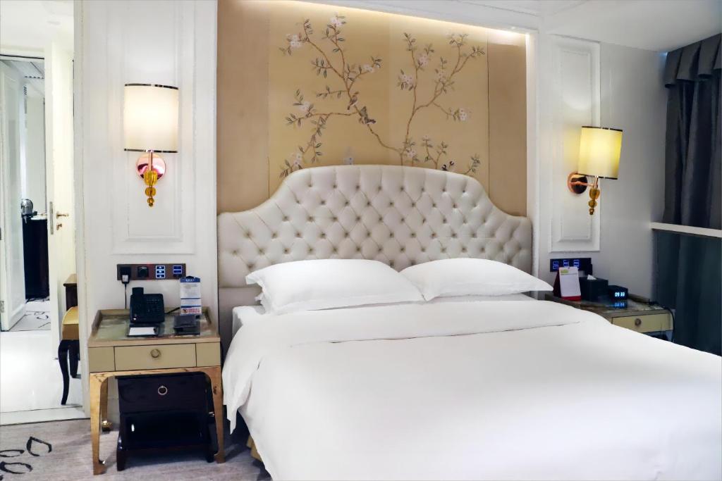 Postel nebo postele na pokoji v ubytování Estandon Hotel Guangzhou