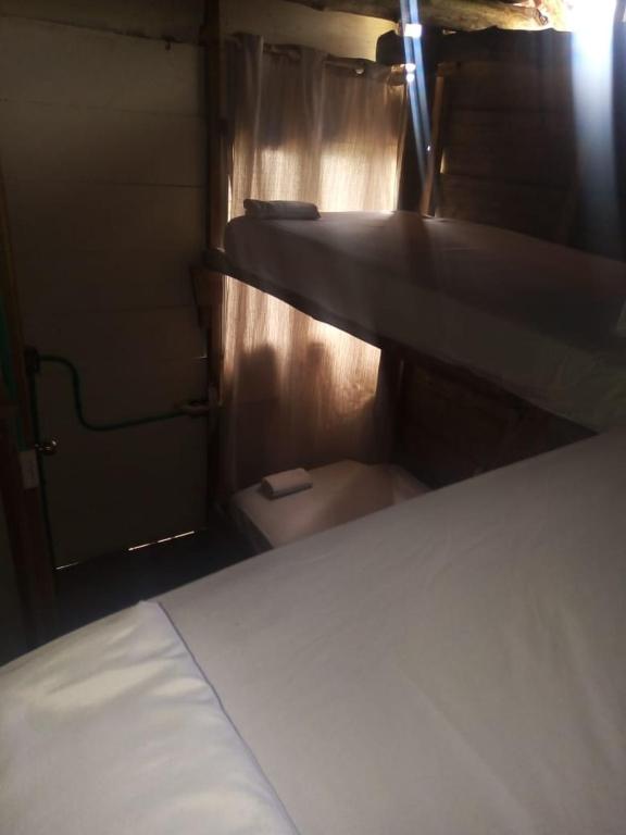 Postel nebo postele na pokoji v ubytování Mi Cabañita Guest House