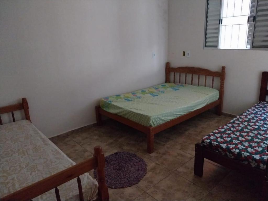 Кровать или кровати в номере Casa de campo Maciel