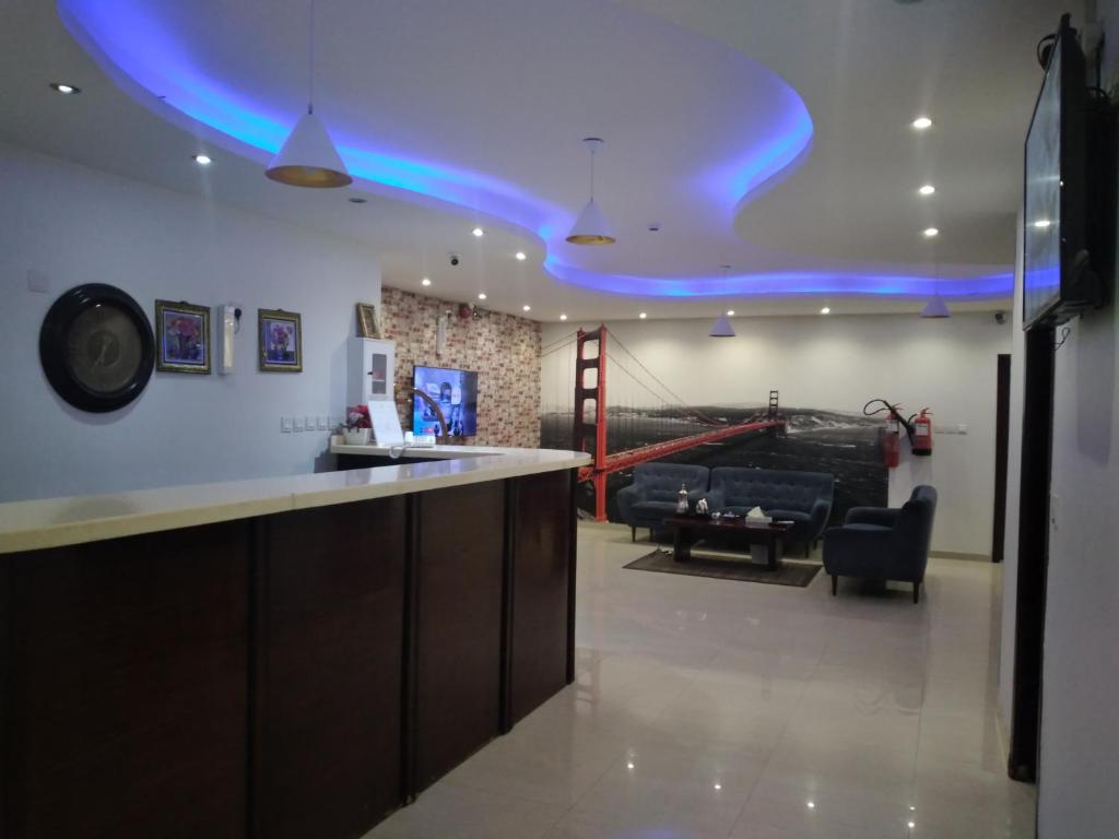 a bar with a blue light on the ceiling at سحاب فيو in Abha