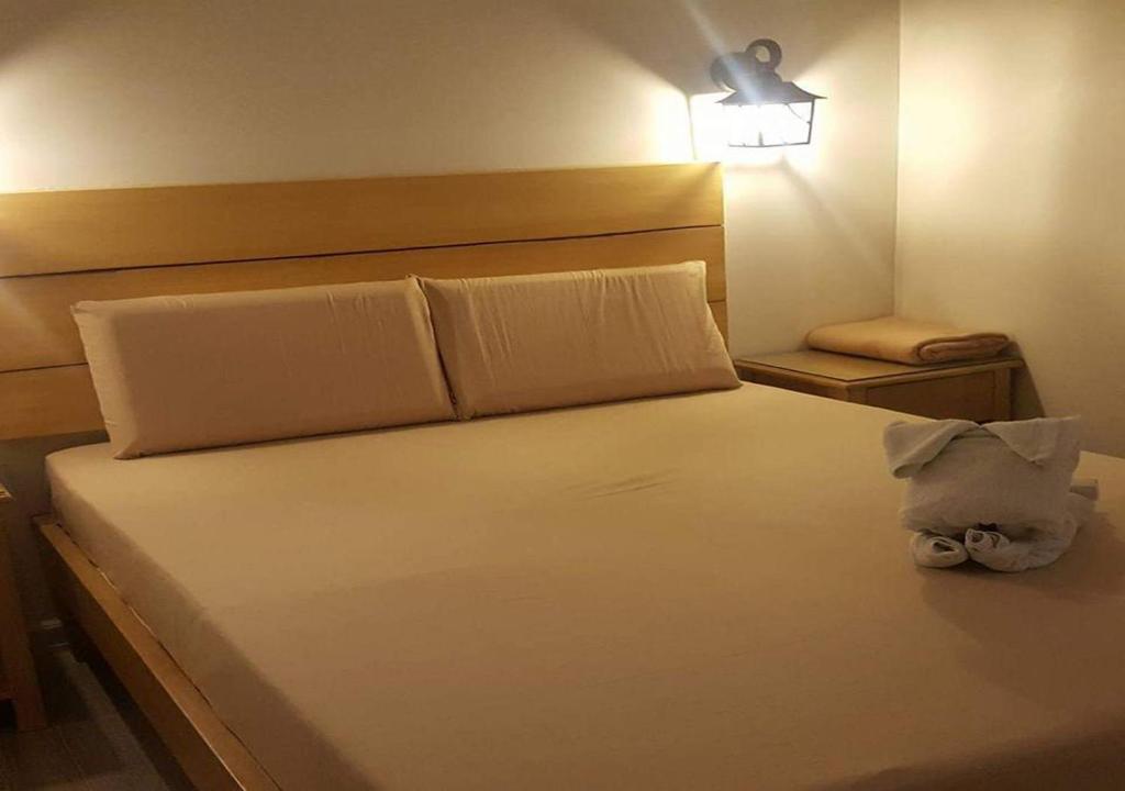 Postel nebo postele na pokoji v ubytování Le Verde Lodge