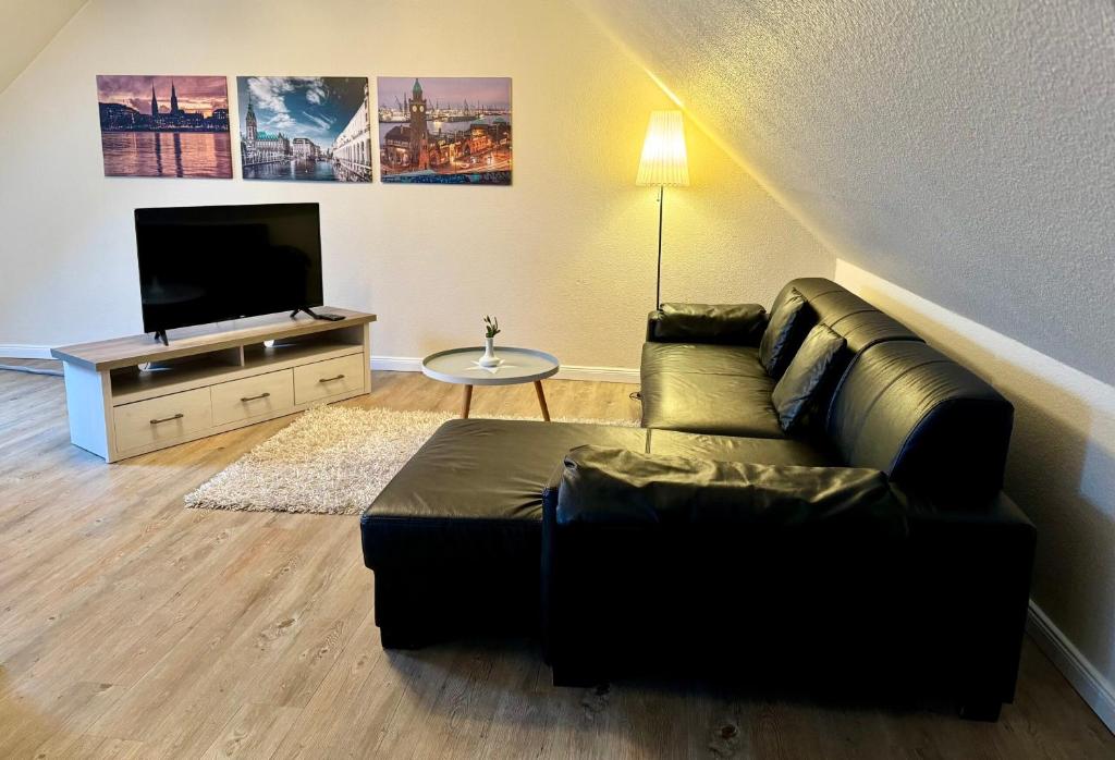 TV a/nebo společenská místnost v ubytování Residenz Hotel Neu Wulmstorf