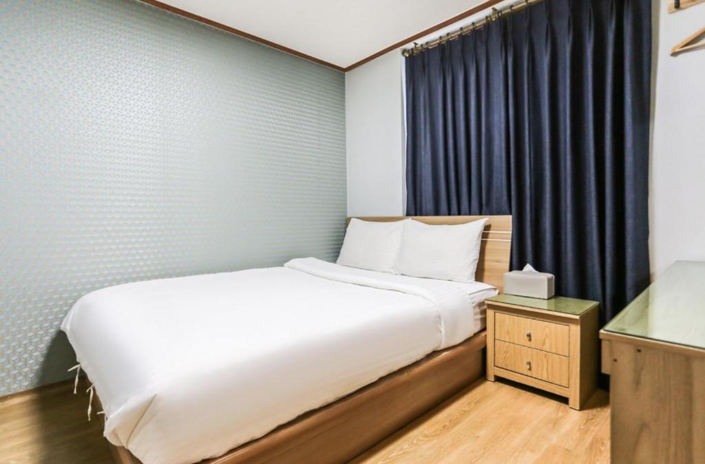 Postel nebo postele na pokoji v ubytování Nokwon Motel