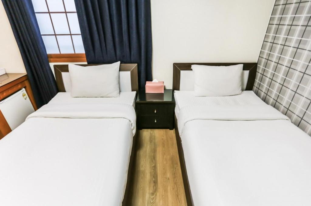 Postel nebo postele na pokoji v ubytování Nokwon Motel