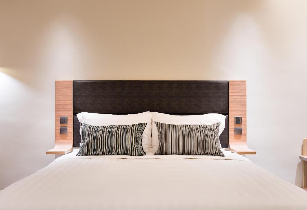 Voodi või voodid majutusasutuse Camlux Hotel toas