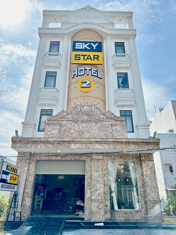a white building with a sky star hotel sign on it at Sky Star 2 Hotel in Can Tho