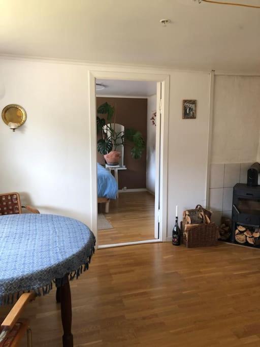 a room with a hallway and a room with a bed at Cosy aparment in Bergen in Bergen