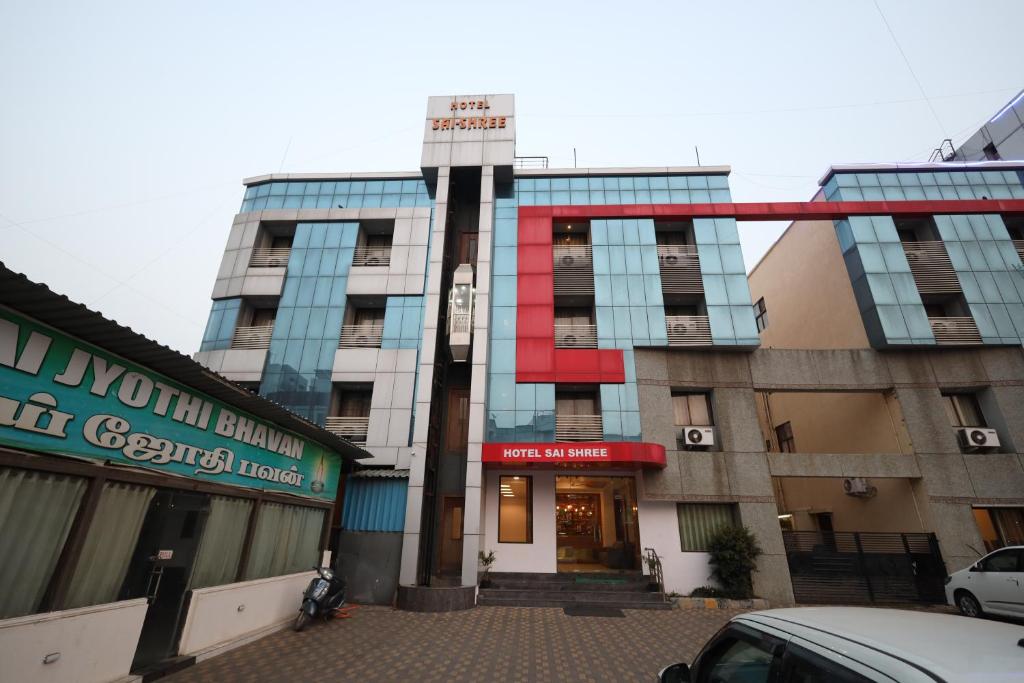 a building with a sign on the front of it at Hotel Saishree` in Shirdi