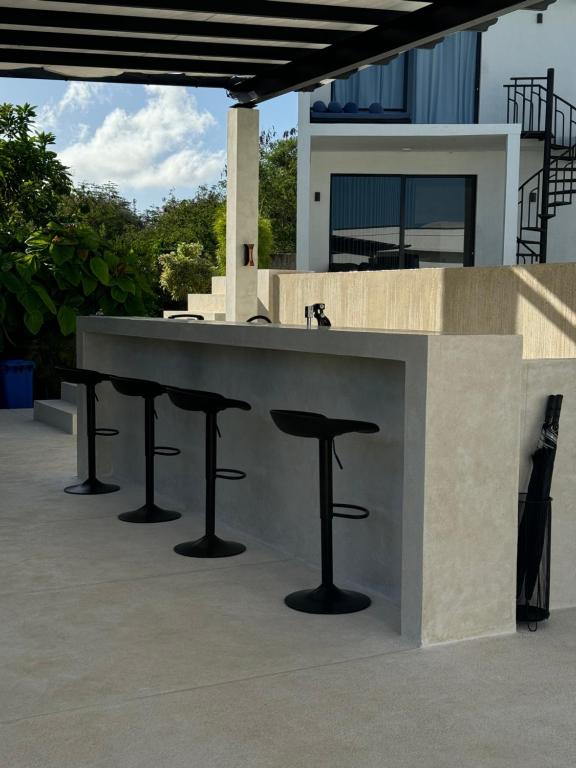 a bar on the roof of a house at Villa Valeria in Ungasan