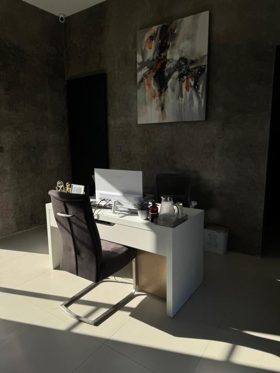an office with a desk with a chair and a computer at Villa Valeria in Ungasan