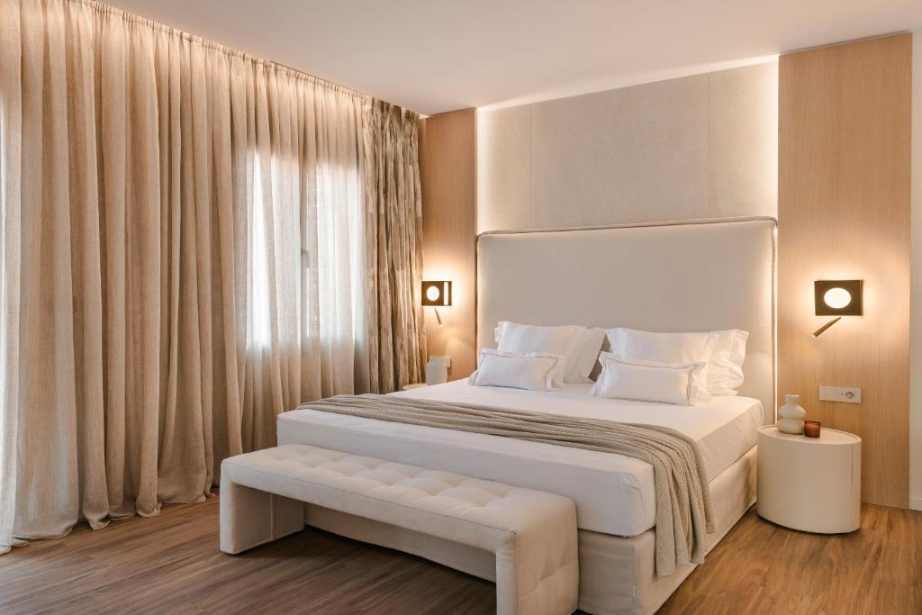 Postel nebo postele na pokoji v ubytování PIAZZA SUITES
