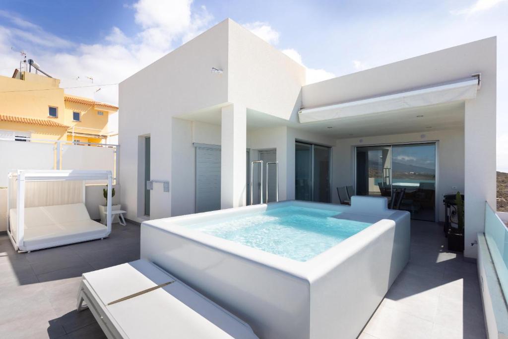 a swimming pool on the roof of a house at Home Of Tulio in Adeje