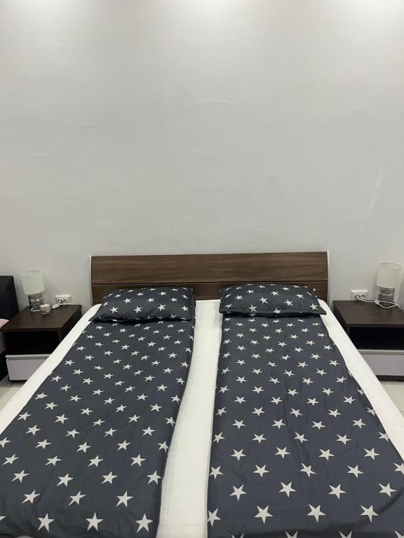 a bedroom with a bed with an american flag at SMART GuestHouse in Oradea