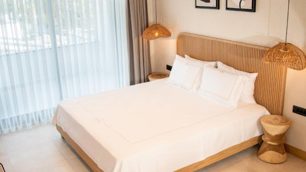 Postel nebo postele na pokoji v ubytování Club Kavala Beach Hotel Assos