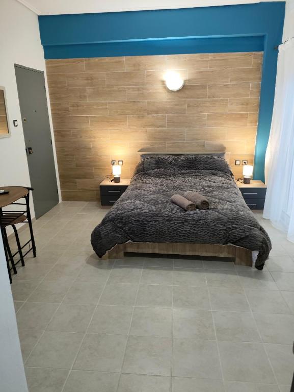 a bedroom with a bed with two pillows on it at GM 7 ROOMS KENTRO στην καρδιά της πόλης in Larisa