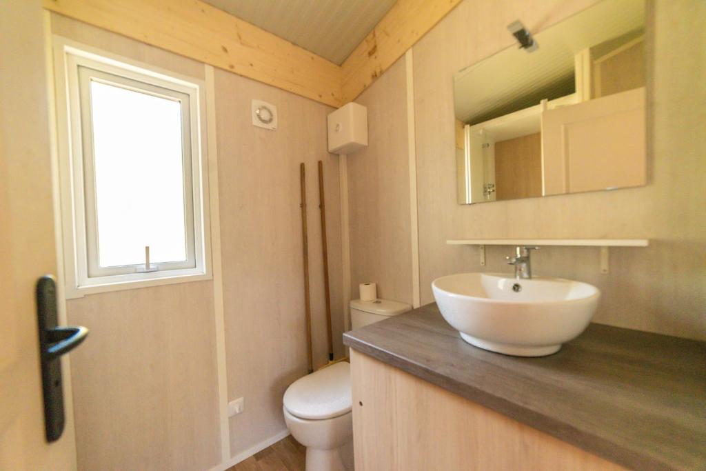 a bathroom with a sink and a toilet at Domaine La Pinède Enchantée in Argelès-sur-Mer