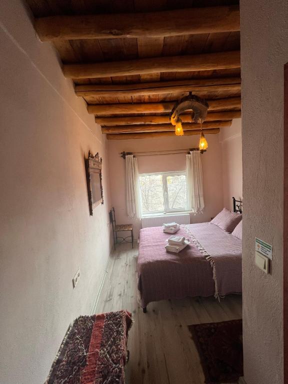 Postel nebo postele na pokoji v ubytování Zen Cappadocia