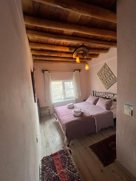 Postel nebo postele na pokoji v ubytování Zen Cappadocia