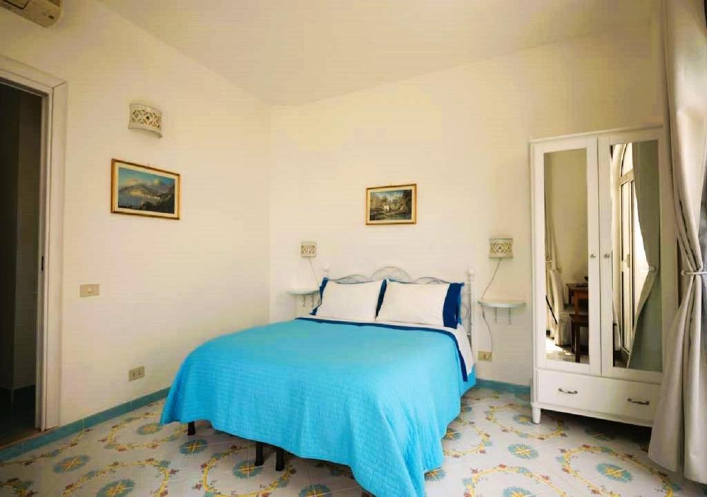 Postel nebo postele na pokoji v ubytování B&B Venus Inn Positano
