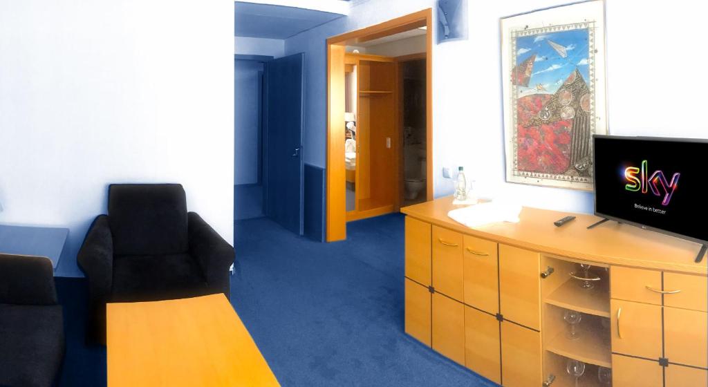TV a/nebo společenská místnost v ubytování Hotel Bavaria Brehna