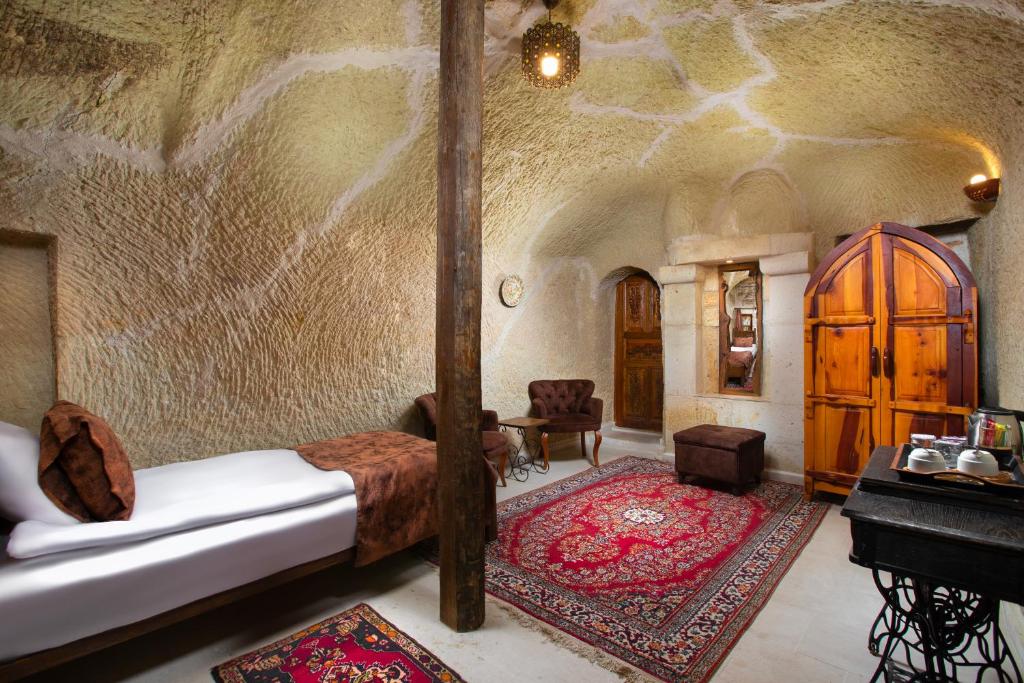 A bed or beds in a room at Romantic Cave Hotel