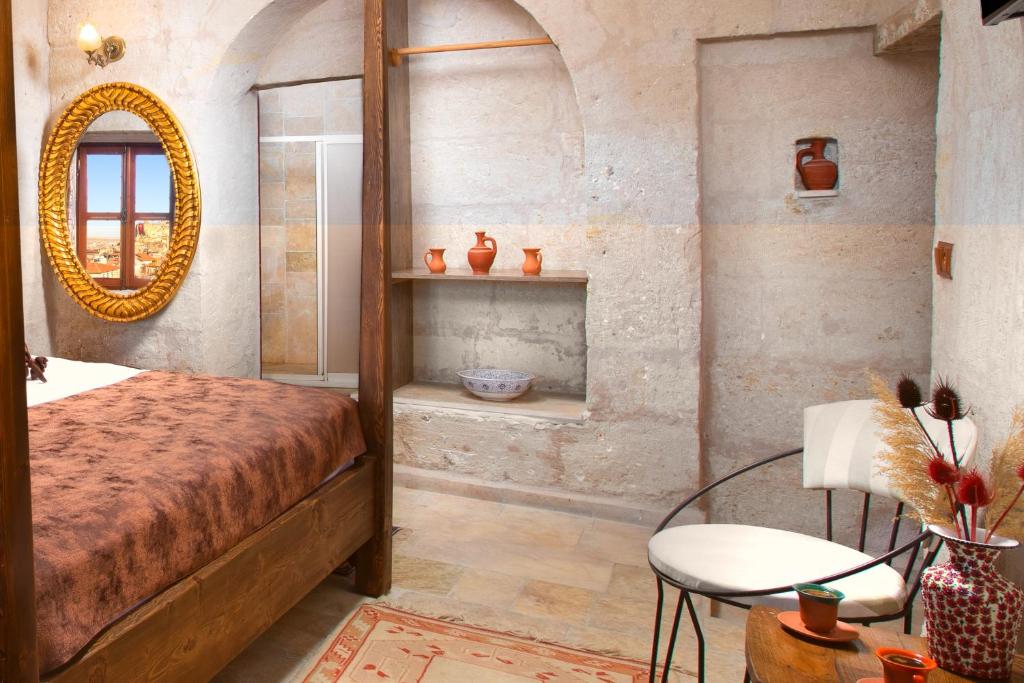 A bed or beds in a room at Romantic Cave Hotel