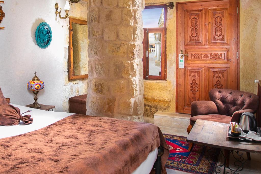 A bed or beds in a room at Romantic Cave Hotel