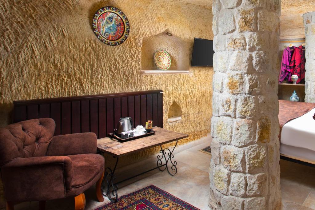 A bed or beds in a room at Romantic Cave Hotel