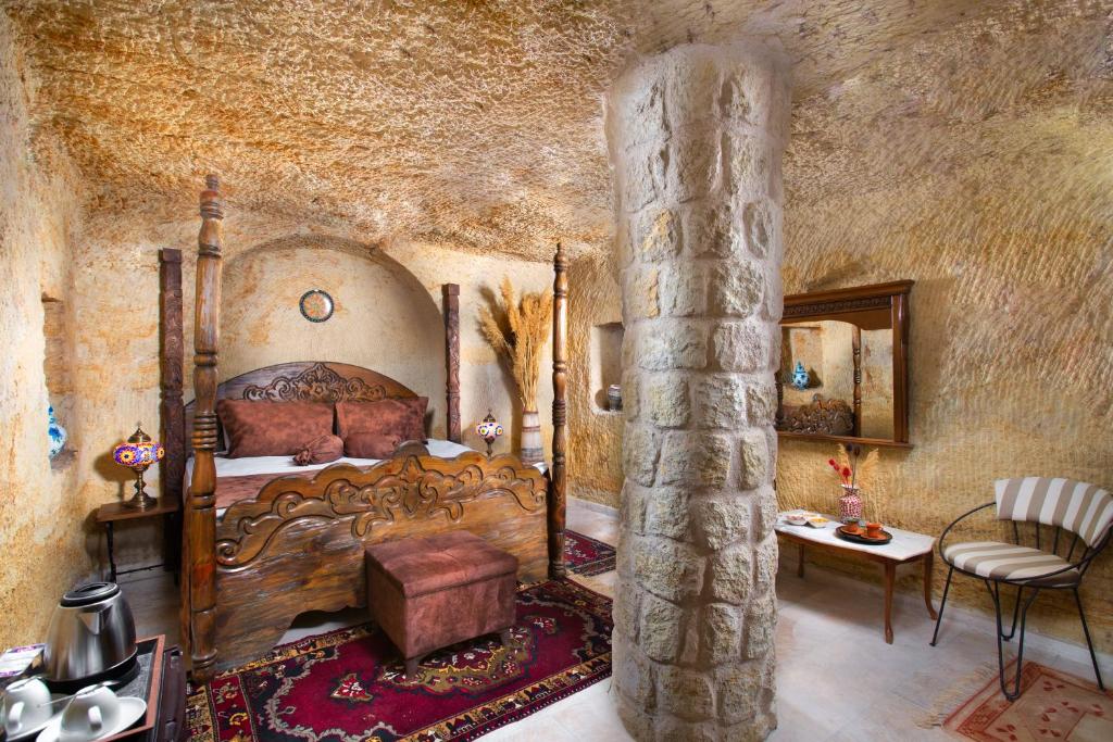 A bed or beds in a room at Romantic Cave Hotel