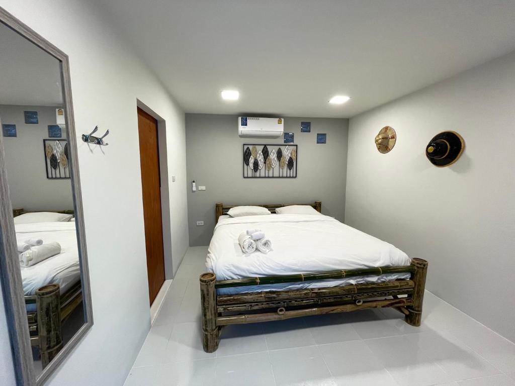 Tempat tidur dalam kamar di Bamboo Garden Resort