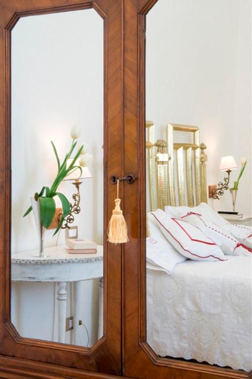 Postel nebo postele na pokoji v ubytování Palazzo De Giorgi B&B