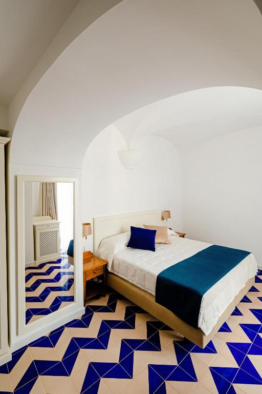 Ένα ή περισσότερα κρεβάτια σε δωμάτιο στο Hotel Da Raffaele