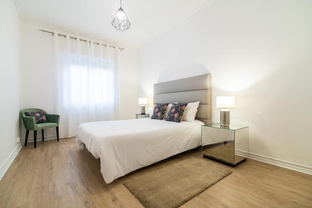 Postel nebo postele na pokoji v ubytování Green Island City Apartment