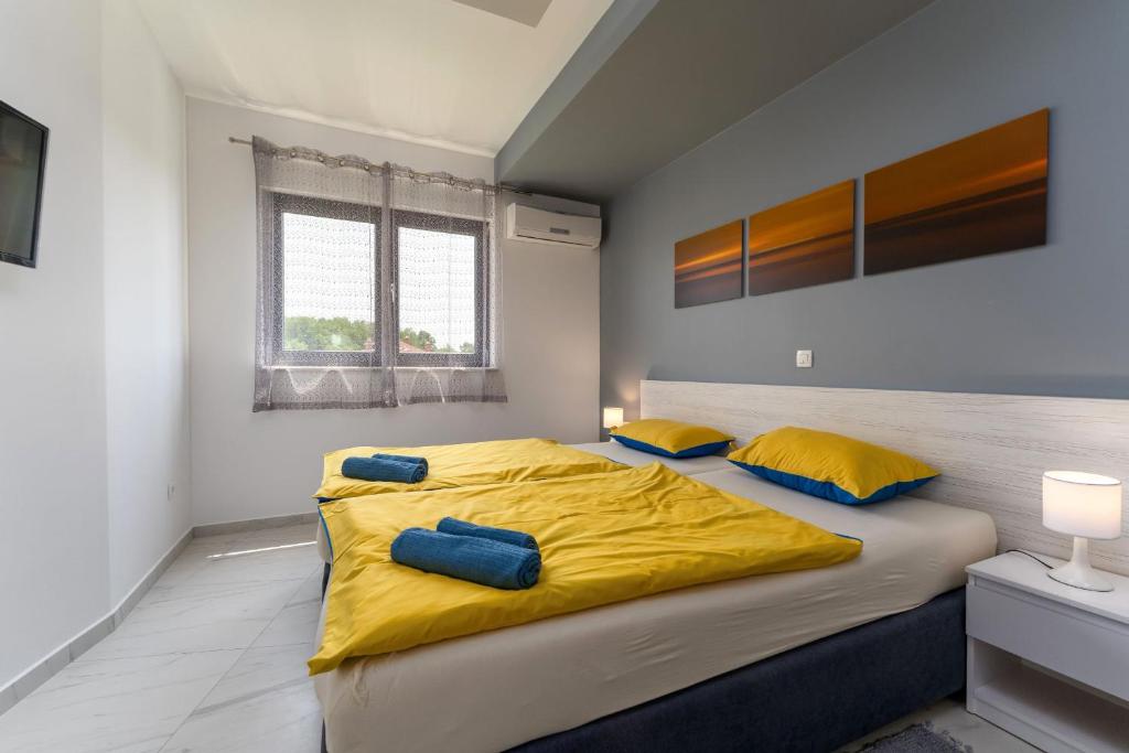 Postel nebo postele na pokoji v ubytování Villa Papillon