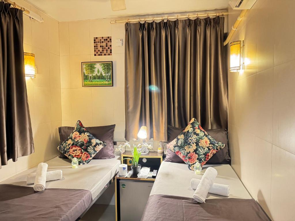 Ένα ή περισσότερα κρεβάτια σε δωμάτιο στο International Inn