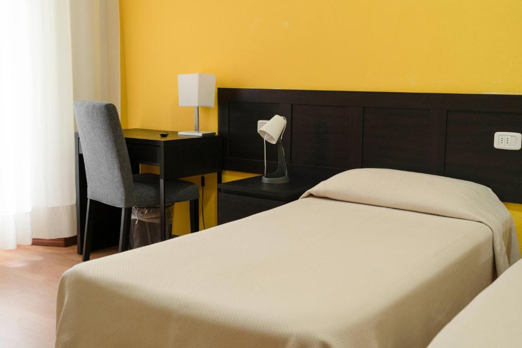 Postel nebo postele na pokoji v ubytování Albergo San Lorenzo