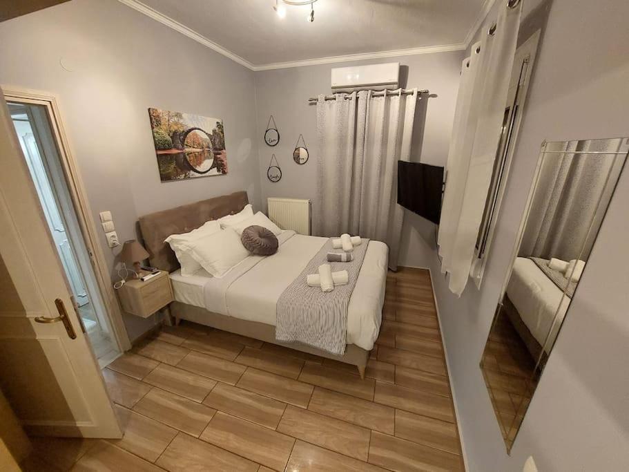 a small bedroom with a bed with candles on it at Φιλοξενία in Ioannina
